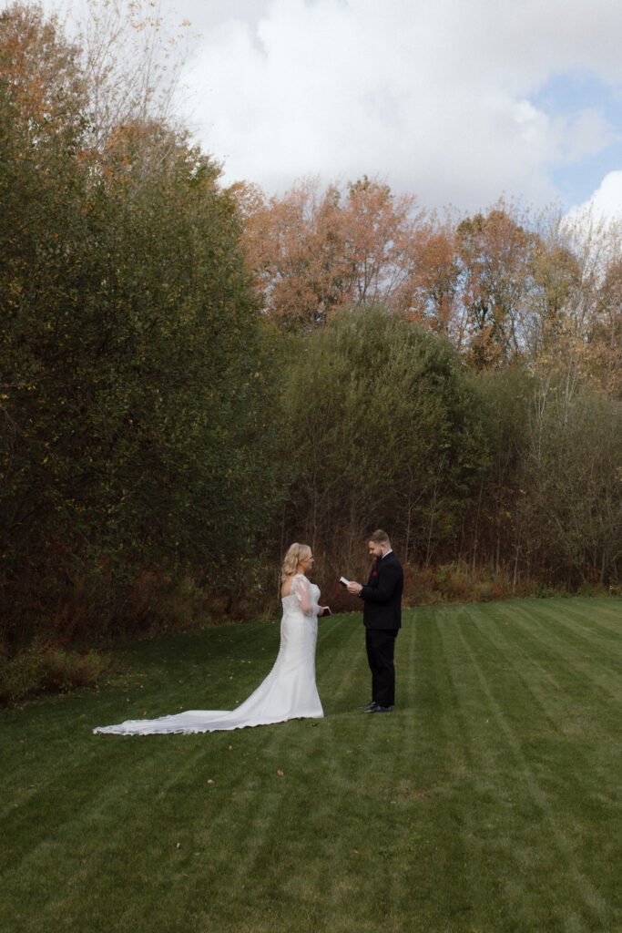 Private vow reading – Megan and Tom exchanging personal vows during a quiet, private moment.
